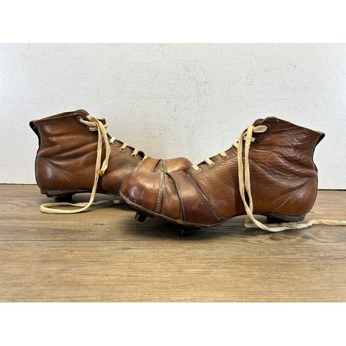 545 - A pair of 1940s brown leather football boots with fitted Rubstud studs