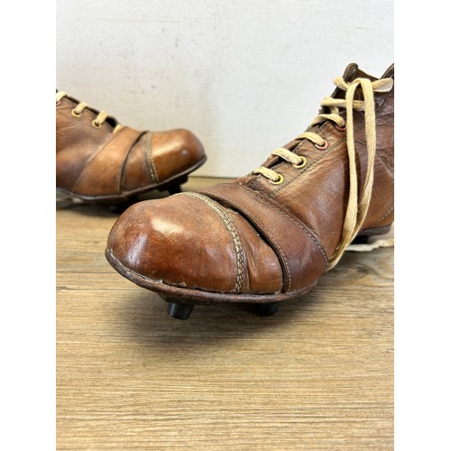 545 - A pair of 1940s brown leather football boots with fitted Rubstud studs