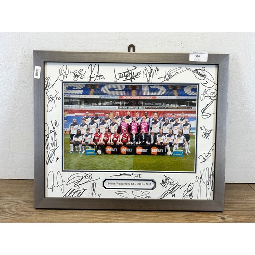 550 - A framed and signed Bolton Wanderers F.C. 2011-2012 photograph - approx. 32cm high x 42cm wide