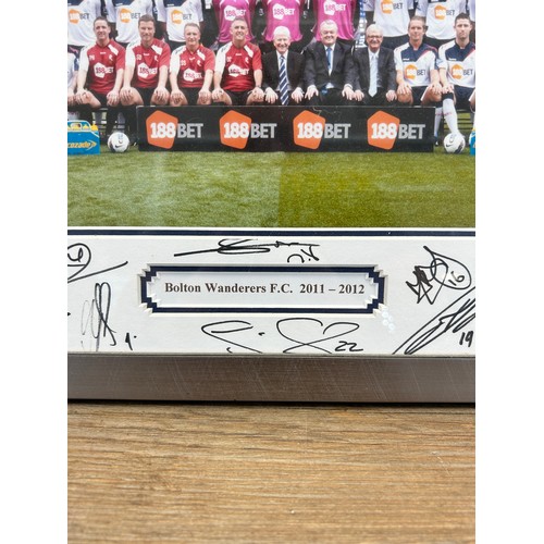 550 - A framed and signed Bolton Wanderers F.C. 2011-2012 photograph - approx. 32cm high x 42cm wide