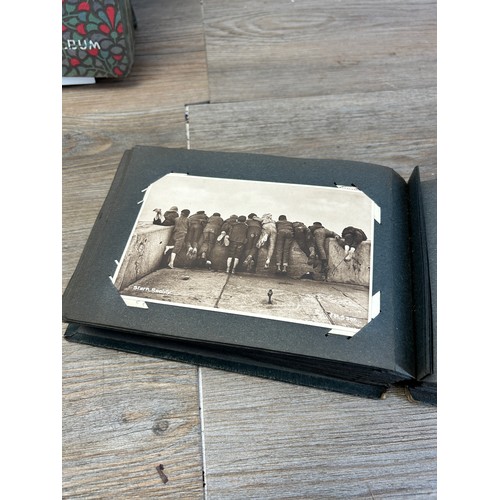 553 - A collection of antique and vintage photographs and postcards