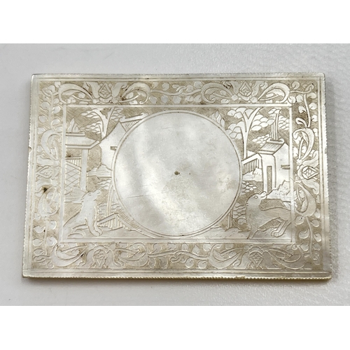 2329 - A Chinese etched mother of pearl plaque - approx. 3.5cm high x 5cm wide