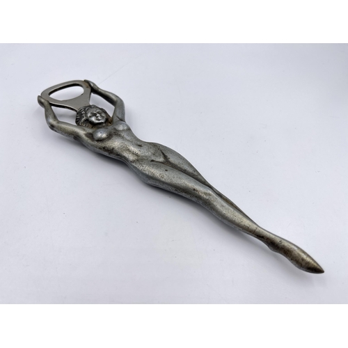 2331 - A mid 20th century Rostfri SMS metal nude lady bottle opener - approx. 21cm long