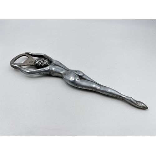 2331 - A mid 20th century Rostfri SMS metal nude lady bottle opener - approx. 21cm long