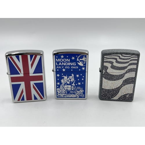 2332 - Three Zippo cigarette lighters to include Moon Landing etc.