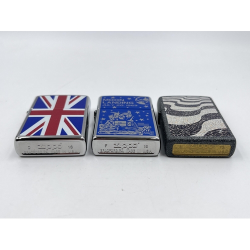 2332 - Three Zippo cigarette lighters to include Moon Landing etc.