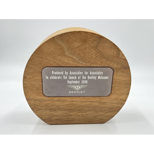 2340 - A Bentley Motors wooden cased plaque - approx. 12cm diameter