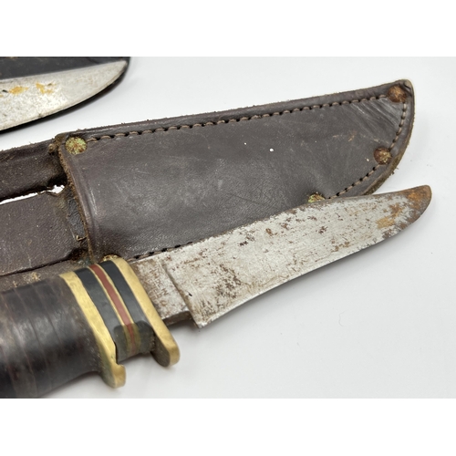 2342 - Two William Rodgers hunting knives with leather sheaths