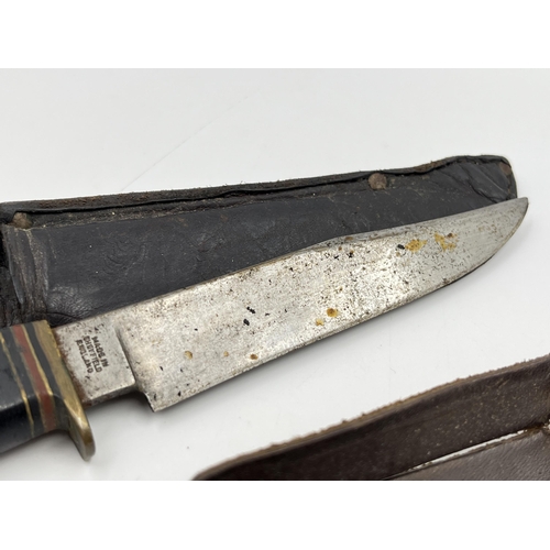 2342 - Two William Rodgers hunting knives with leather sheaths