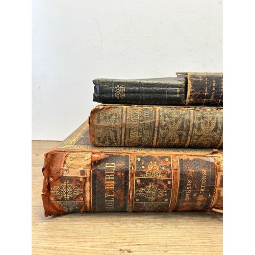 558 - Six antique leather bound books, five Holy Bibles and one The Life & Explorations of Dr. Livingstone... 