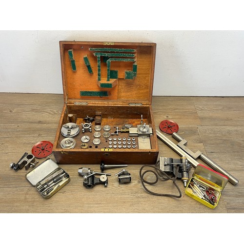 2235 - A World War era war finish oak cased watchmaker's lathe with The Bernard Chuck and accessories