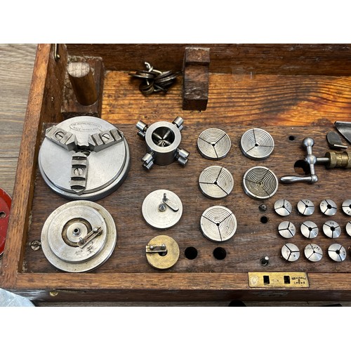 2235 - A World War era war finish oak cased watchmaker's lathe with The Bernard Chuck and accessories