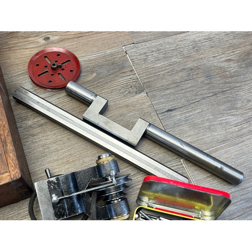 2235 - A World War era war finish oak cased watchmaker's lathe with The Bernard Chuck and accessories