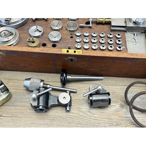 2235 - A World War era war finish oak cased watchmaker's lathe with The Bernard Chuck and accessories