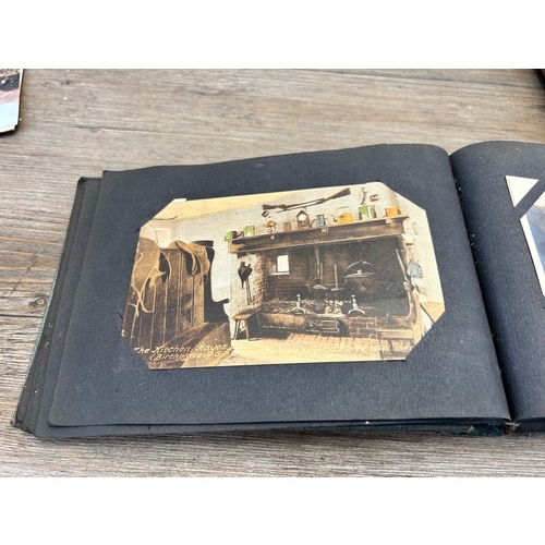 553 - A collection of antique and vintage photographs and postcards