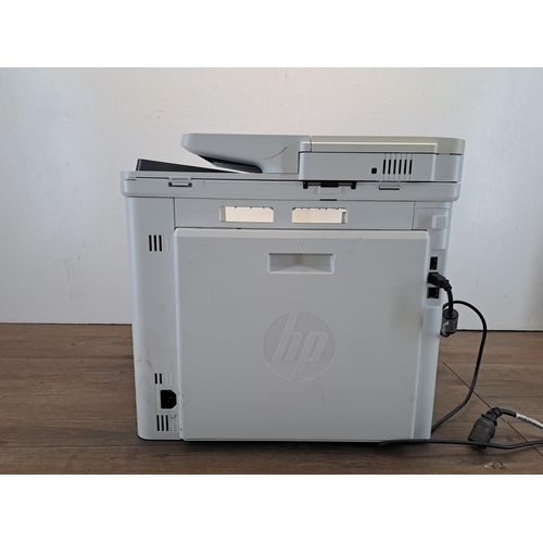 800 - An HP MFP M477fdn Color Laser Jet Pro printer