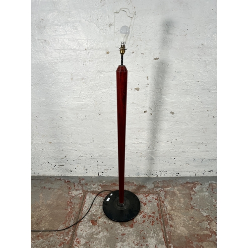 44 - An 1980s red and black painted wooden standard lamp attributed to Heal's - approx. 140cm high