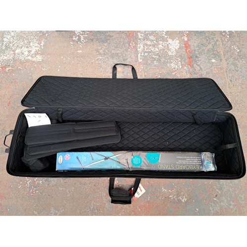 791 - Two items, one Stagg KTC-140D keyboard case with wheels (RRP £199) and one boxed keyboard stand