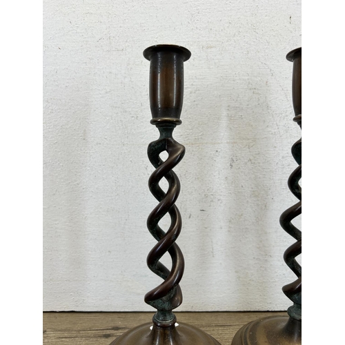 422 - A pair of 19th century copper spiral candlesticks - approx. 26cm high