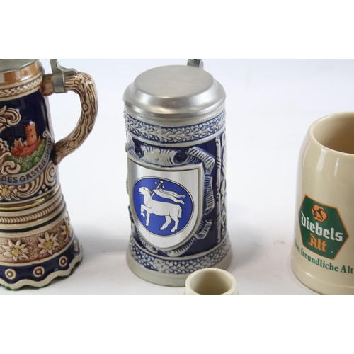 386 - Nine ceramic and glass mugs to include Royal Doulton Old Charley, Royal Doulton Desperate Dan, Germa... 