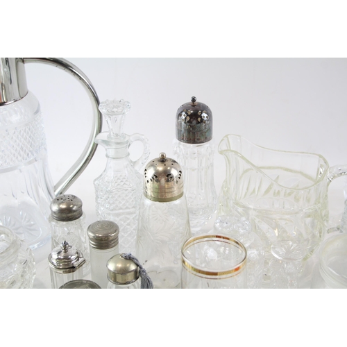 387 - A collection of kitchenware to include cut glass sugar shaker, bottles, jug etc.