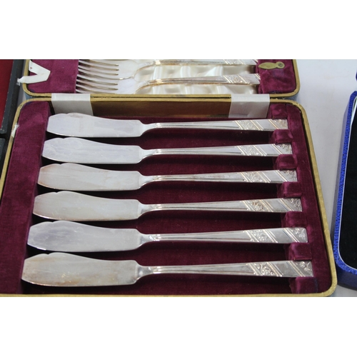 447 - Three sets of vintage mother of pearl and ivorine fish cutlery