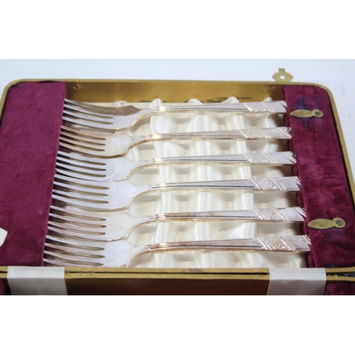 447 - Three sets of vintage mother of pearl and ivorine fish cutlery