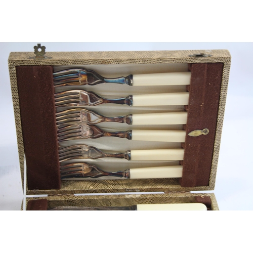 448 - Three vintage silver plated fish cutlery sets in wooden canteens