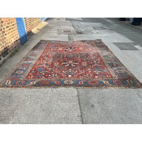 27 - An antique Persian hand knotted rug - approx. 360cm x 305cm