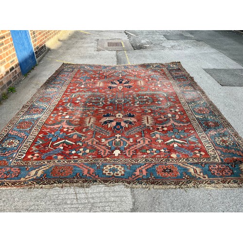 27 - An antique Persian hand knotted rug - approx. 360cm x 305cm