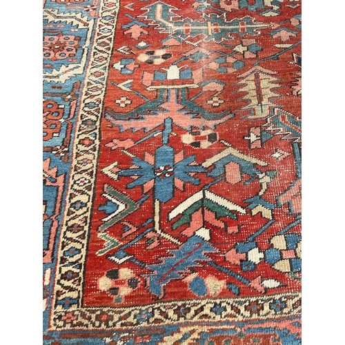 27 - An antique Persian hand knotted rug - approx. 360cm x 305cm