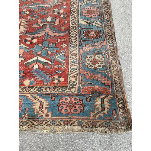 27 - An antique Persian hand knotted rug - approx. 360cm x 305cm