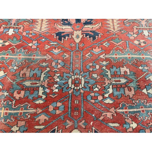 27 - An antique Persian hand knotted rug - approx. 360cm x 305cm