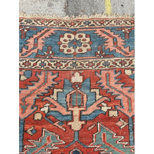 27 - An antique Persian hand knotted rug - approx. 360cm x 305cm