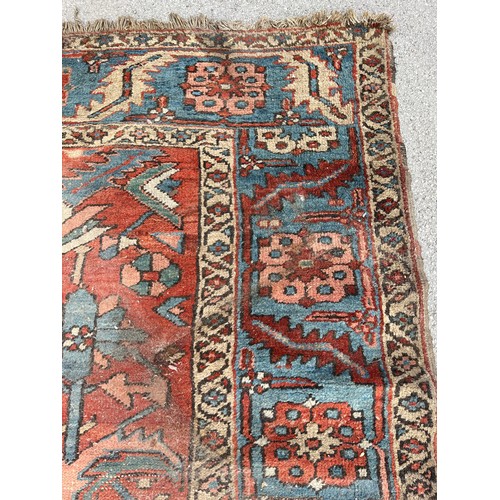 27 - An antique Persian hand knotted rug - approx. 360cm x 305cm