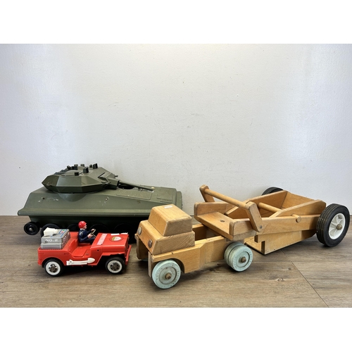 491 - Three vintage model vehicles, one wooden lorry, one tin plate and plastic fire chief and one Alvis p... 