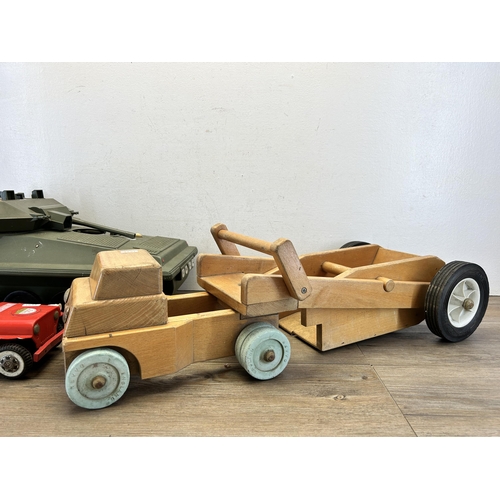 491 - Three vintage model vehicles, one wooden lorry, one tin plate and plastic fire chief and one Alvis p... 