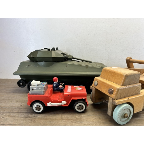 491 - Three vintage model vehicles, one wooden lorry, one tin plate and plastic fire chief and one Alvis p... 