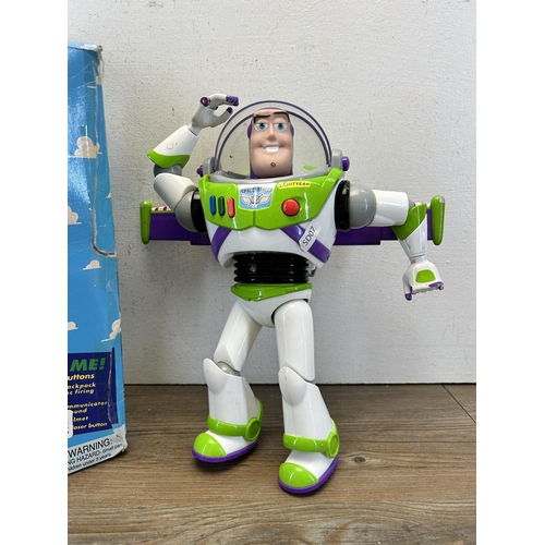 496 - Two Walt Disney Toy Story Buzz Lightyear figurines, one boxed Intergalactic and one unboxed