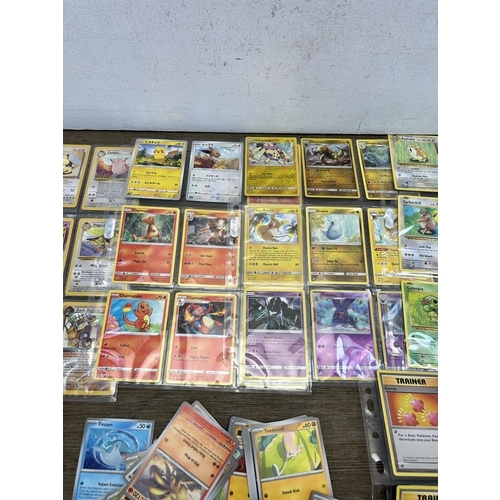 497 - A collection of Pokémon trading cards to include Unified Minds, Burning Shadows, 1999 Fossil and Tea... 