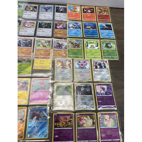 498 - A collection of Pokémon trading cards to include Chinese Hidden Fates, Vivid Voltage part set etc.