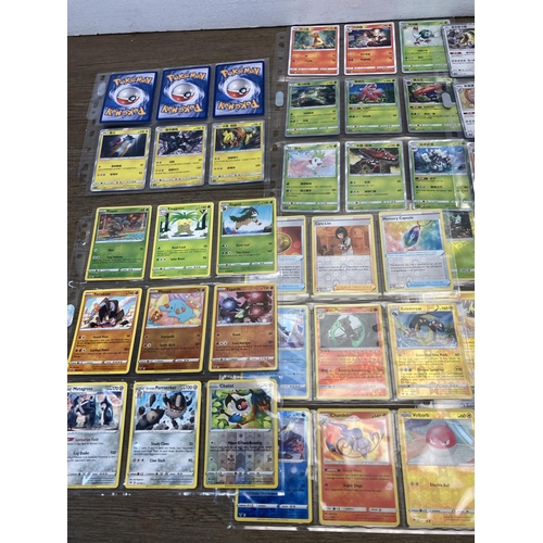 498 - A collection of Pokémon trading cards to include Chinese Hidden Fates, Vivid Voltage part set etc.