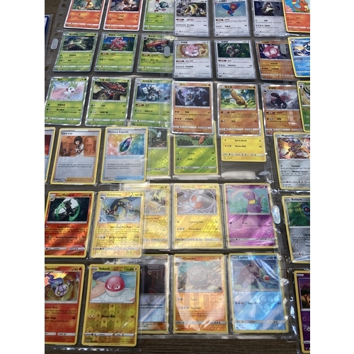 498 - A collection of Pokémon trading cards to include Chinese Hidden Fates, Vivid Voltage part set etc.