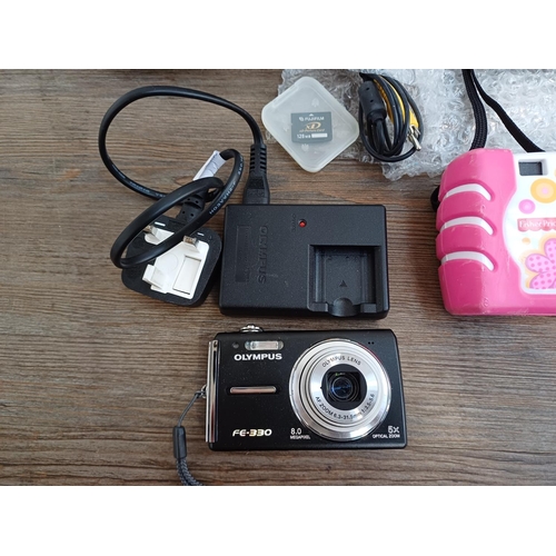 690 - Five digital cameras to include Olympus FE-330 8mp compact with charger, boxed Fujifilm FinePix A405... 