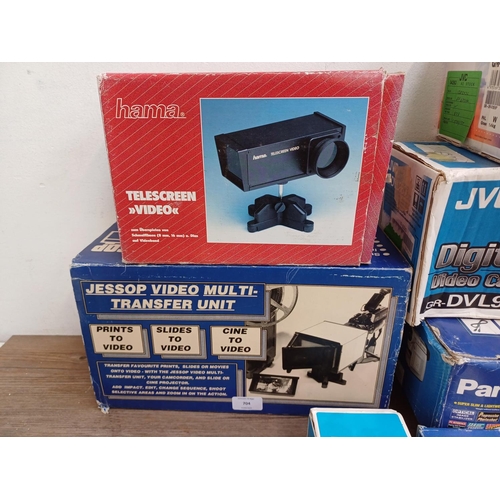 704 - Seven boxed items to include JVC and Panasonic digital camcorders, Praktica BC3600 flashgun, Jessop ... 