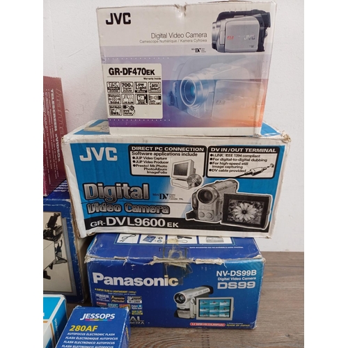 704 - Seven boxed items to include JVC and Panasonic digital camcorders, Praktica BC3600 flashgun, Jessop ... 