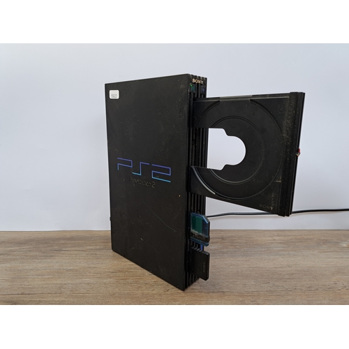 804 - A collection of items to include Sony PlayStation console, Sony PlayStation 2, SpeedLink Black Widow... 