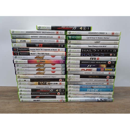 808 - A collection of video game consoles, controllers, games and accessories to include one Xbox 360 S co... 