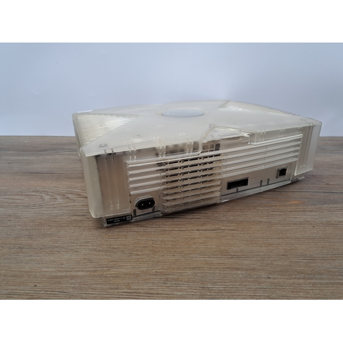 813 - An Xbox Crystal translucent console with two Crystal translucent controllers