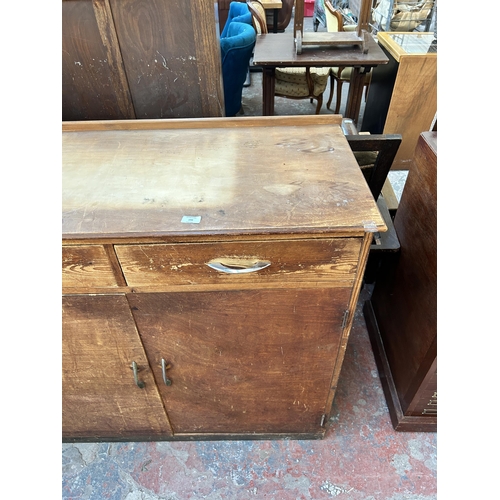 202 - A mid 20th century pine and plywood sideboard - approx. 102cm high x 111cm wide x 50cm deep